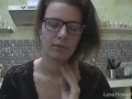 Solo girl with glasses chatting in the kitchen