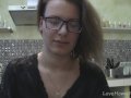 Solo girl with glasses chatting in the kitchen