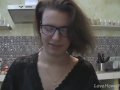 Solo girl with glasses chatting in the kitchen