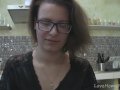 Solo girl with glasses chatting in the kitchen