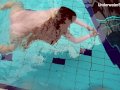 Redhead Simonna showing her body underwater