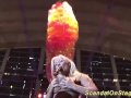 busty oiled Milf on public show stage