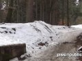 Girls in need skate around in the snow to find a proper place to have a pee