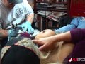 Shyla Stylez gets tattooed while playing with her tits