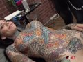 Tiger Lilly gets a forehead tattoo while naked