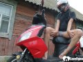 Biker girl masturbates on her red motorcycle